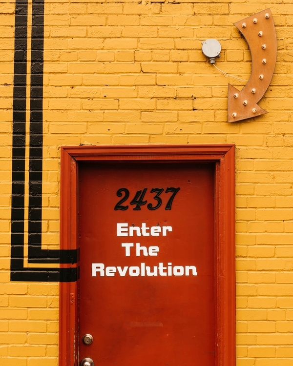 Door with "Enter The Revolution" written on it